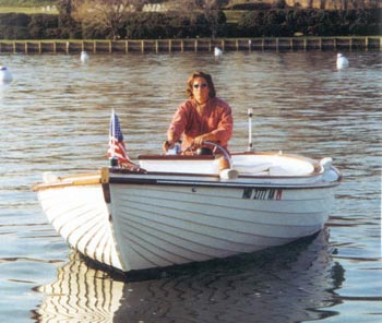 Tommy Solomon at the helm of a restored "Sea Otter".