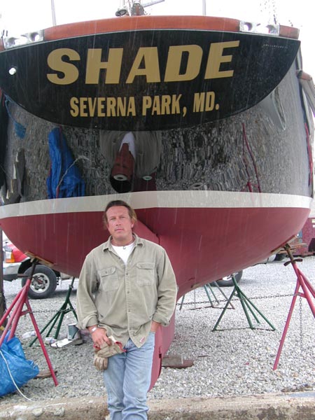 Tommy Solomon at the stern of the newly restored "Shade"